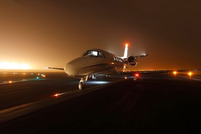 Plane on the runway at night
