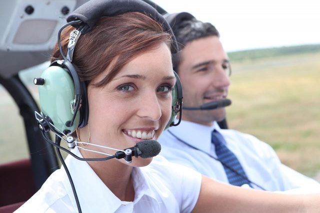 Female airline pilot in the right seat.