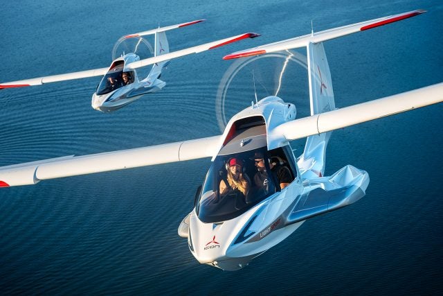 Two Icon A5s in flight