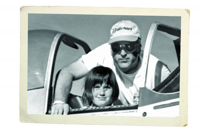 Maria Morrison and her father sit in a Mustang in the pits, circa 2004.