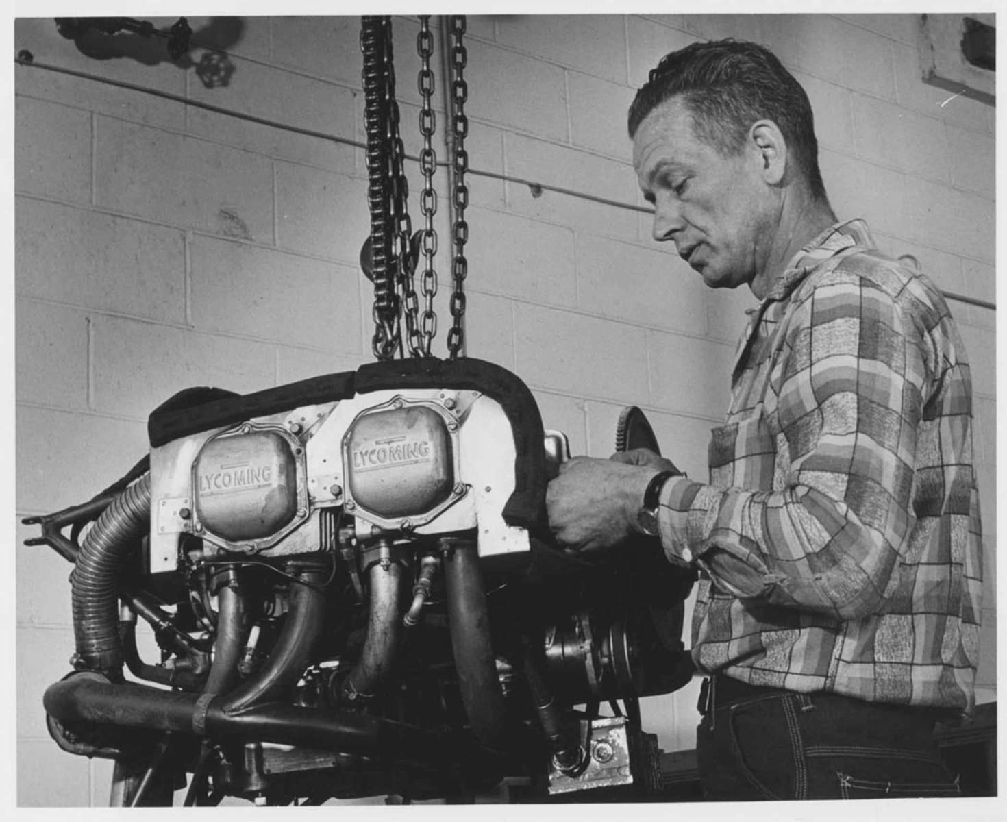 A four-cylinder Lycoming engine being worked on 