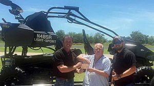 Getting their pink Special Airworthiness Certificate. Shown are Stewart Hamel, CEO & Founder; Doug Leinberger FAA Air Safety Investigator from the Ft. Worth MIDO; and, Cody Lackey, Director of Production for SkyRunner.