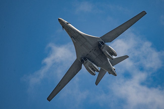 B-1 fly-by, wings extended.
