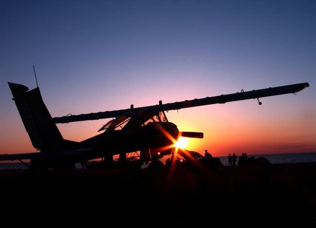 Time Flies: airplane at sunset