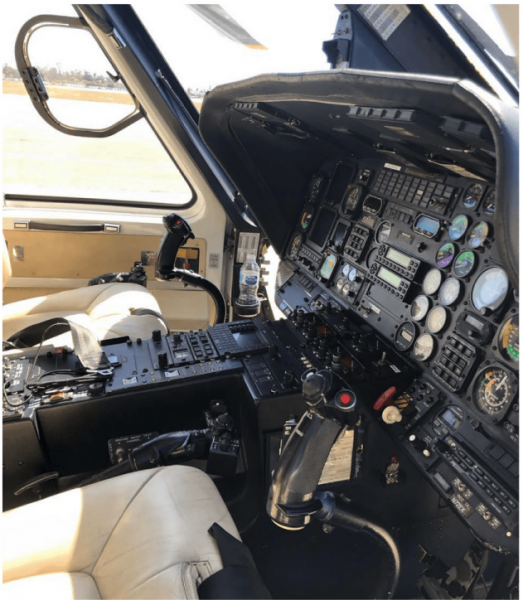 A cockpit of a N72EX helicopter.