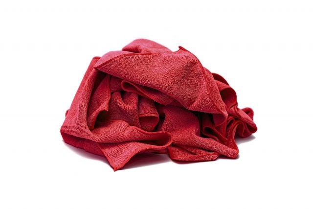 It was determined that fibers from a red shop towel in the fuel selector valve led to an unusual fuel starvation mishap.