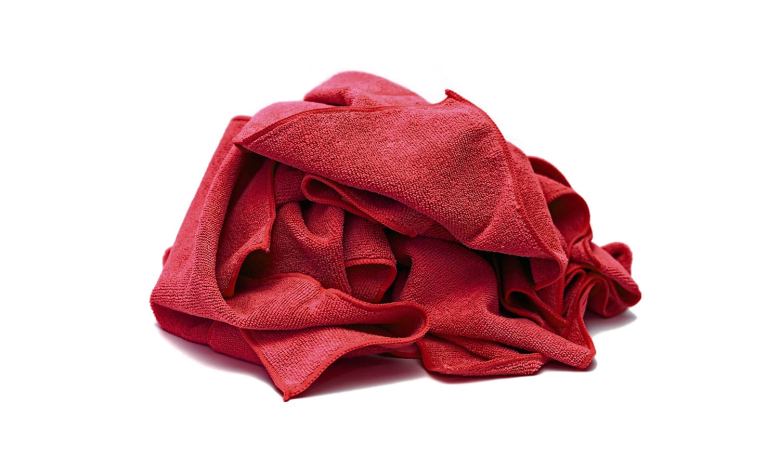 It was determined that fibers from a red shop towel in the fuel selector valve led to an unusual fuel starvation mishap.