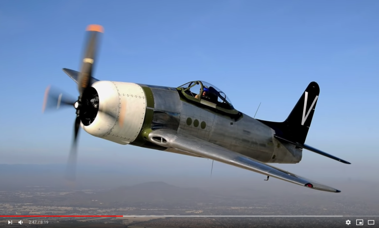A screenshot of a restored Grumman F8F Bearcat in flight.