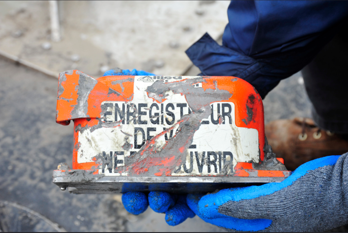 An investigator holds the flight data recorder of the Boeing 767-300 that crashed in February of 2019 while on approach to Houston’s George Bush International Airport. Photo courtesy of NTSB.