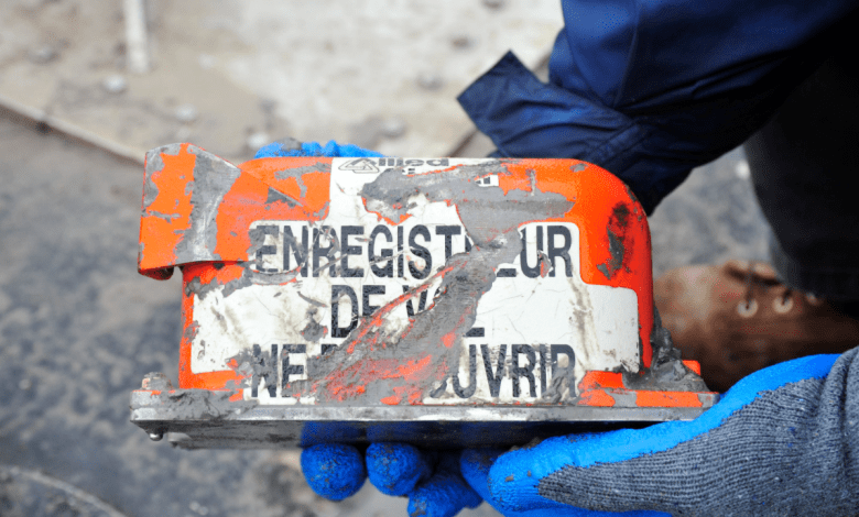An investigator holds the flight data recorder of the Boeing 767-300 that crashed in February of 2019 while on approach to Houston’s George Bush International Airport. Photo courtesy of NTSB.