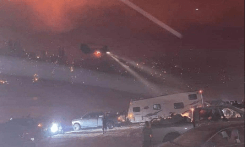 A screencap of the California National Guard rescuing people from a wildfire.