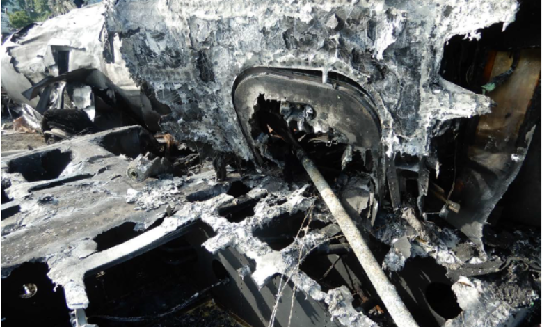 The emergency escape hatch of Dale Earnhardt, Jr's plane impaled by a metal fence post. Photo courtesy of NTSB