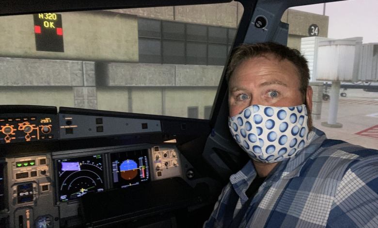 The author, the pandemic beard ’hidden under the mask,’ in the Airbus simulator getting ready to knock the rust off. Photo by Jeremy King