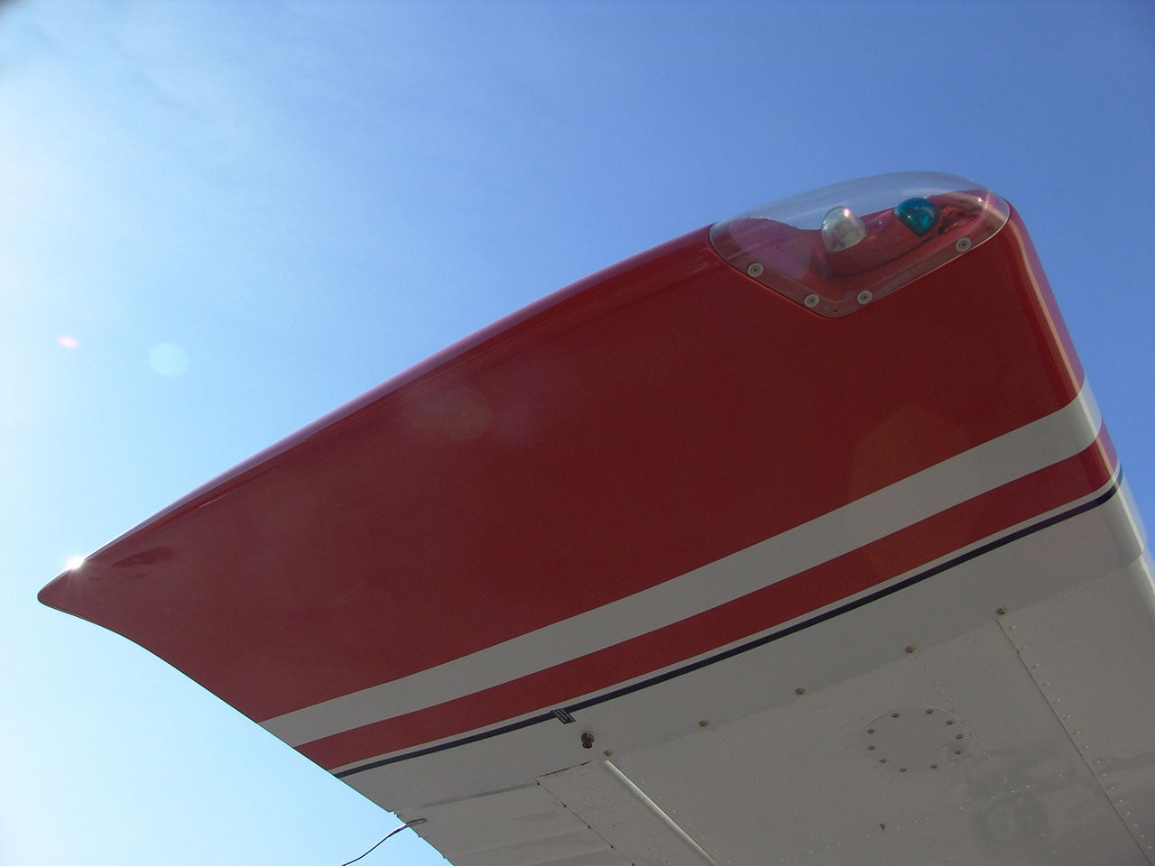An older Cessna with an add-on aux fuel tank.