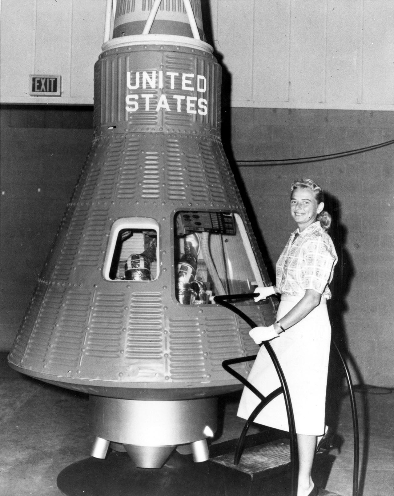 Jerrie Cobb in a publicity photo shoot with a space capsule.