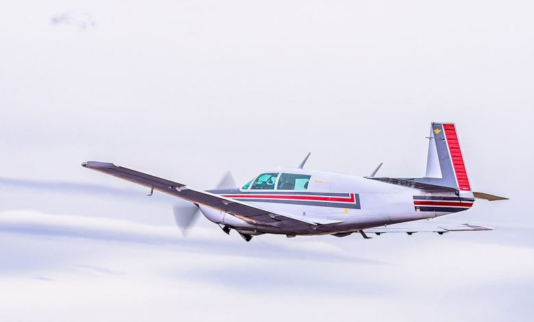 A Mooney flying in the clouds - How Threats Can Keep Pilots Safe - Plane & Pilot