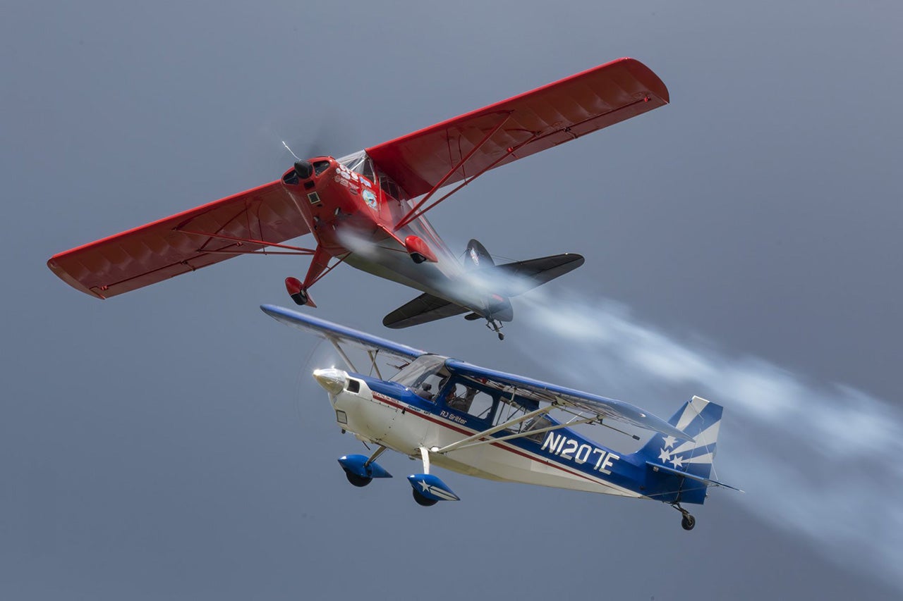 Erik Edgren in his Decathlon and and R.J. Gritter in his clipped-wing T-Craft showed that slow and gentle can be very entertaining! Photo by Jim Koepnick