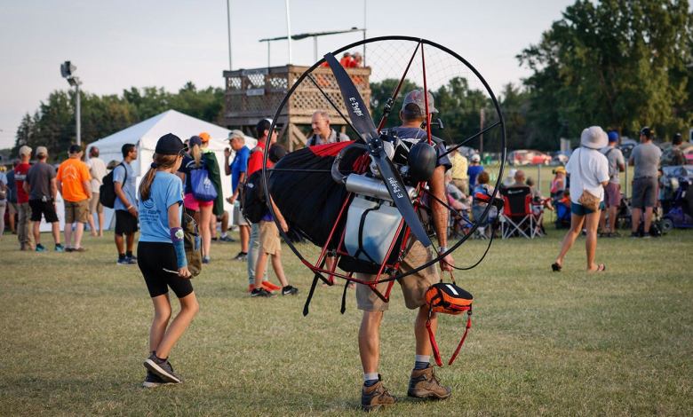 Off to fly with his powered parachute - EAA AirVenture Oshkosh 2022