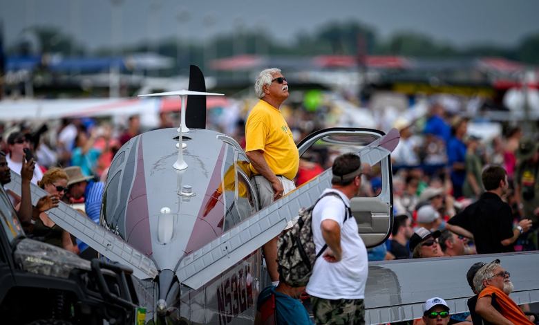 V-35 Bonanza surrounded by airshow spectators