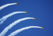 North American T-6 Texans perform at EAA AirVenture Oshkosh. Photo by Cayla McLeod.