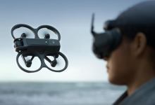 Drone in flight with pilot watching