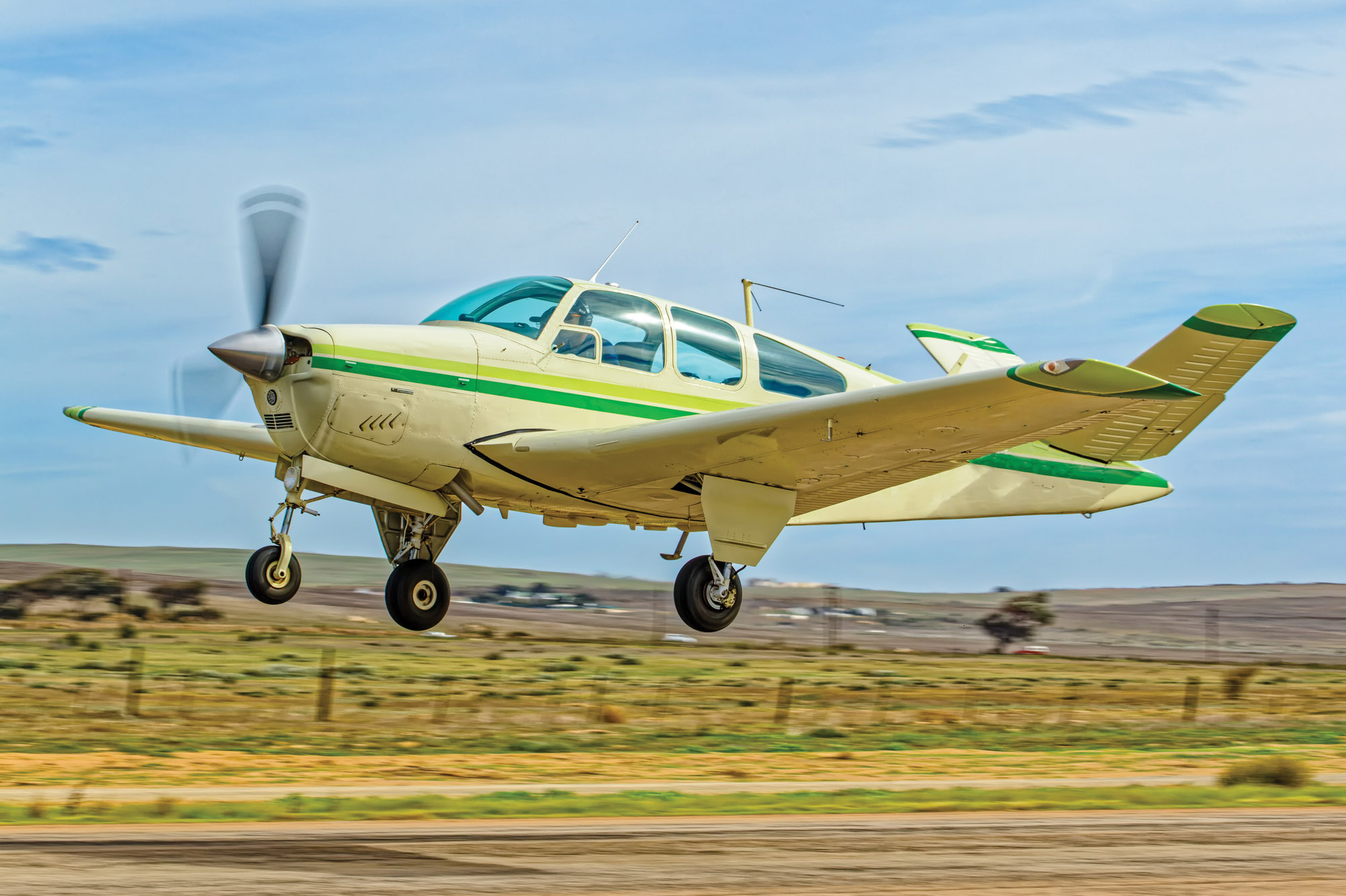 Beechcraft Bonanza taking off into a climb
