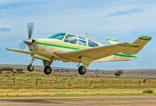 Beechcraft Bonanza taking off into a climb