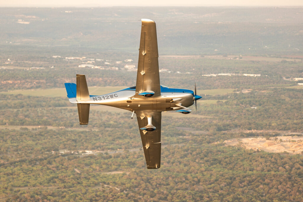 McLeod and Gibson break away from the Cessna 182 photo ship in the skies over Austin, Texas. [Credit: Jack Fleetwood]