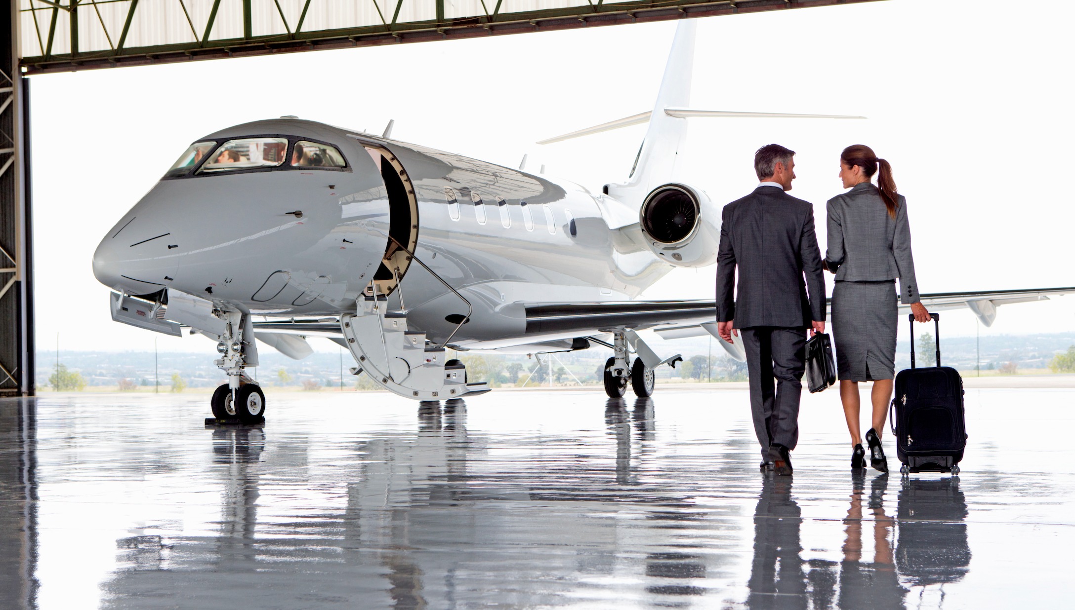 Executives board jet [Shutterstock]