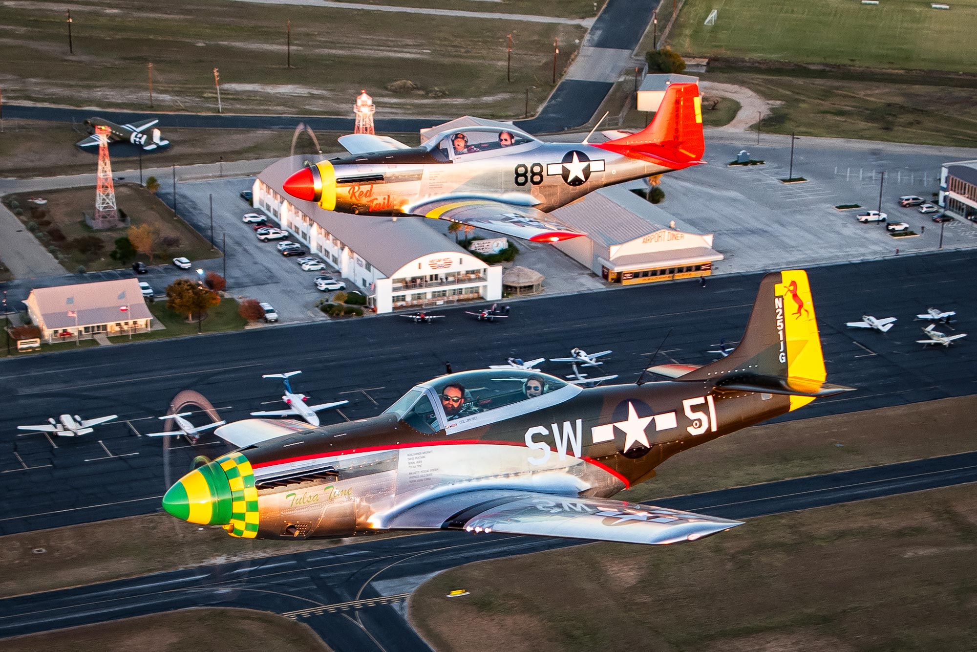 ScaleWings’ SW-51 Mustangs power their way over Gillespie County Airport in Fredericksburg, Texas. [Credit: Glenn Watson]