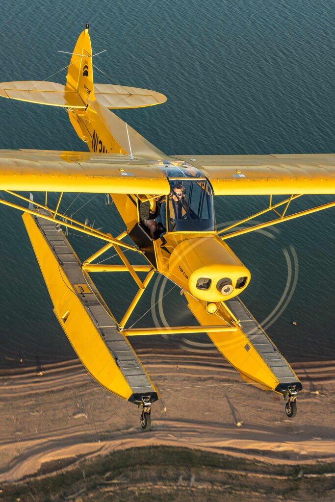 Tres Clinton, the owner and operator of C3 Air in Burnet, Texas, operates a Top Cub on floats. [Credit: Cayla McLeod]