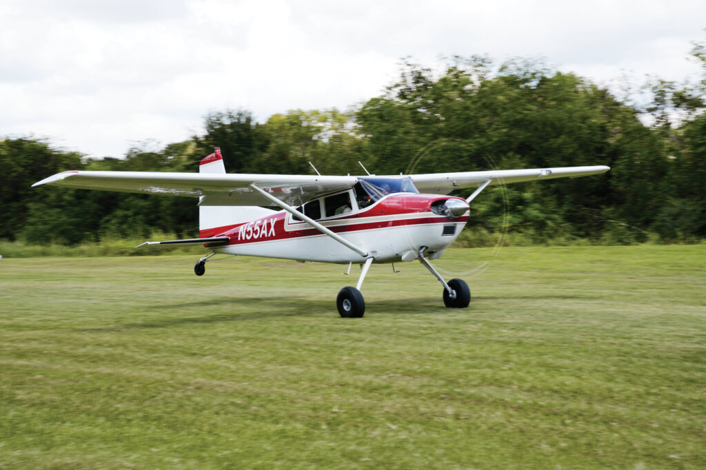 A Cessna 185 departs the Flying V Ranch (T26) after the Under the Wire Fly-In. [Credit: Cayla McLeod]
