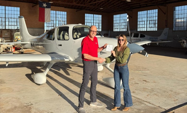 DPE Will Strieder and the author pose after her check ride at Lubbock Preson Smith International Airport (KLBB) in Texas. [Credit: Cayla McLeod]