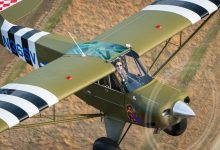 Taking a coffee break at the WACO factory and flying a Husky.