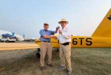 Van's Aircraft founder Richard VanGrunsven (left) hands over the keys to the first MOSAIC aircraft ever delivered to Tom Snow, who chose the Cub Yellow scheme as a tribute to the iconic trainer. [Credit: Van's Aircraft]