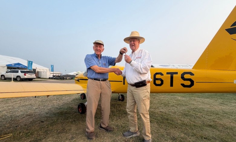 Van's Aircraft founder Richard VanGrunsven (left) hands over the keys to the first MOSAIC aircraft ever delivered to Tom Snow, who chose the Cub Yellow scheme as a tribute to the iconic trainer. [Credit: Van's Aircraft]