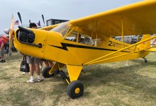 One of three J-3 Cubs being raffled off by the Jim Richmond Backcountry Aviation Foundation on display at Oshkosh. [Credit: Meg Godlewski]
