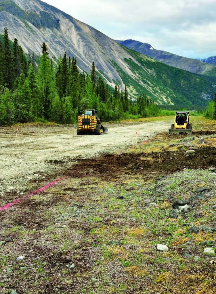 Dedicated RAF volunteers utilize compact track loaders and 
specialized hand tools to clear overgrowth and repair rutted 
surfaces, ensuring that vital backcountry airstrips remain safe. [Credit: Stef Goza]