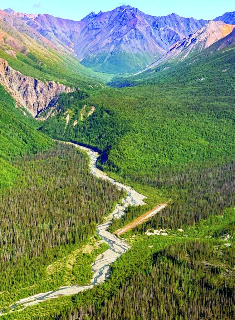 Through collaborative efforts and hard labor, pilot volunteers and land management crews work together at remote sites like Glacier Creek to maintain essential aviation infrastructure. [Credit: Stef Goza]