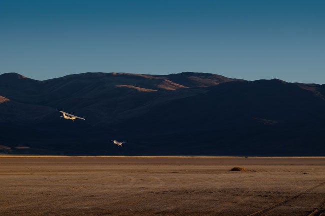 Two planes over Dead Cow Lake at the High Sierra Fly-In