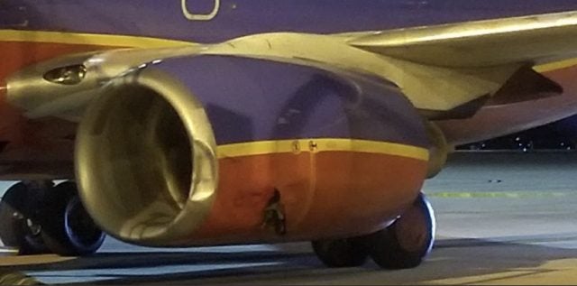A passenger's photo shows damage to the Southwest Airline's jet's engine.